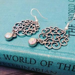 Open scroll whimsy silver earrings with crystal